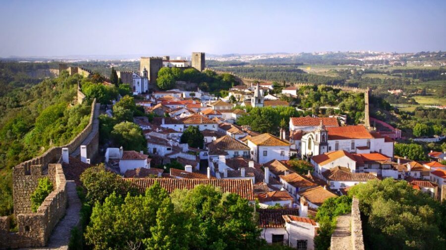 From Lisbon: Fátima, Batalha, Nazaré & Óbidos Full-Day Tour - Óbidos at Dusk: Medieval Walls, Whitewashed Lanes, and Ginjinha
