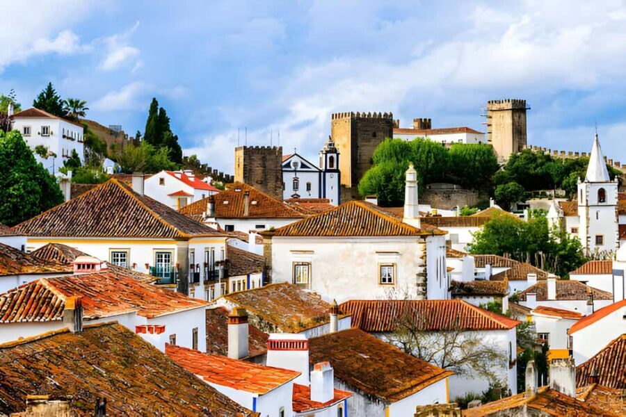 From Lisbon: Obidos, Nazaré and Fátima Small Group Tour - Óbidos inside the walls: Queen Isabel’s town and the ginjinha stop