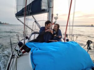 Lisbon: City Skyline Sailboat Cruise with Drink and Snacks - Santo Amaro Dock and the start under the 25 de Abril Bridge