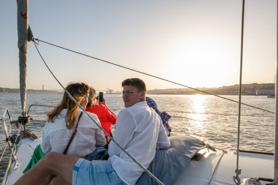 Lisbon: Daytime/Sunset/Night City Sailboat Tour with Drink - Under the 25 de Abril Bridge: the mid-cruise “picture every angle” moment
