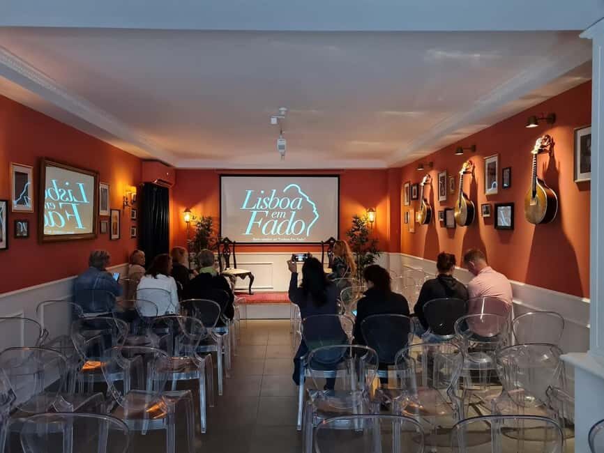 Lisbon: Live Fado Show with Port Wine in Historic Center - Multilingual storytelling in English and Portuguese subtitles