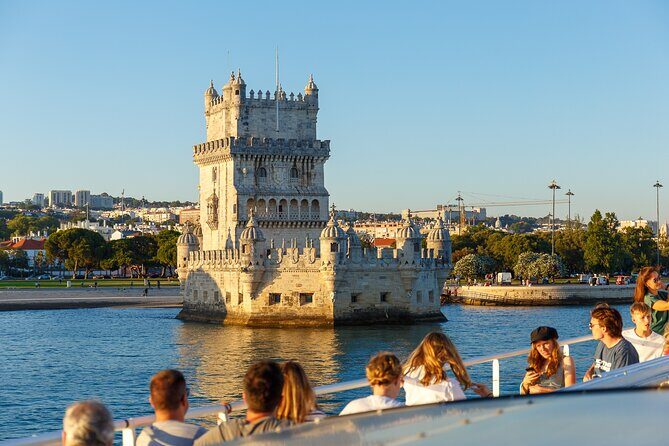 Lisbon Sunset Cruise with Wine and Snacks - Stop by stop: the bridge moment and Belém Tower from the water