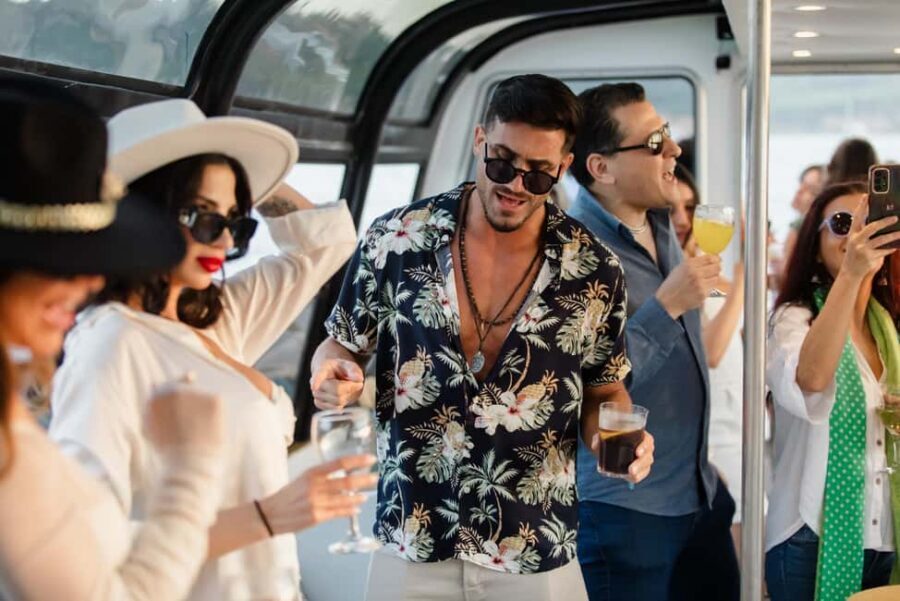 Lisbon: Sunset/Night Boat Party with Open Bar, Snacks & DJ - The party setup: DJ music, dancing, and the open bar flow