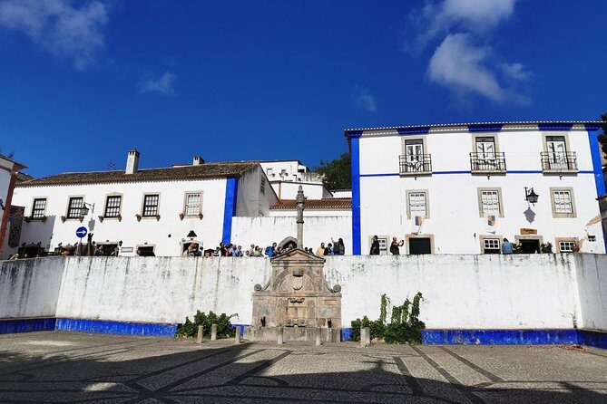 Lisbon to Porto Up To 5 Stops Óbidos Nazaré Fátima Coimbra Aveiro - Fátima: basilicas, Mass timing, and lunch on your schedule