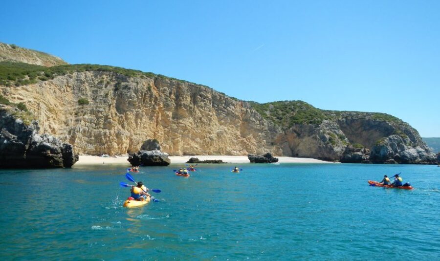 Sesimbra: Arrábida Natural Park Guided Kayaking Tour - Sea caves and cliff views: how the guides help you read the coast